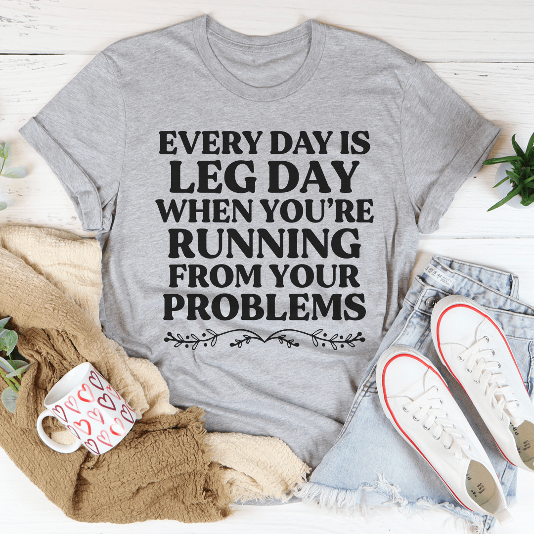 Gray crewneck T-shirt with 'Leg Day' slogan graphic on front