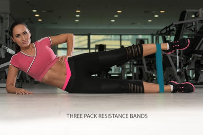 Resistance bands set in use with woman performing leg extension