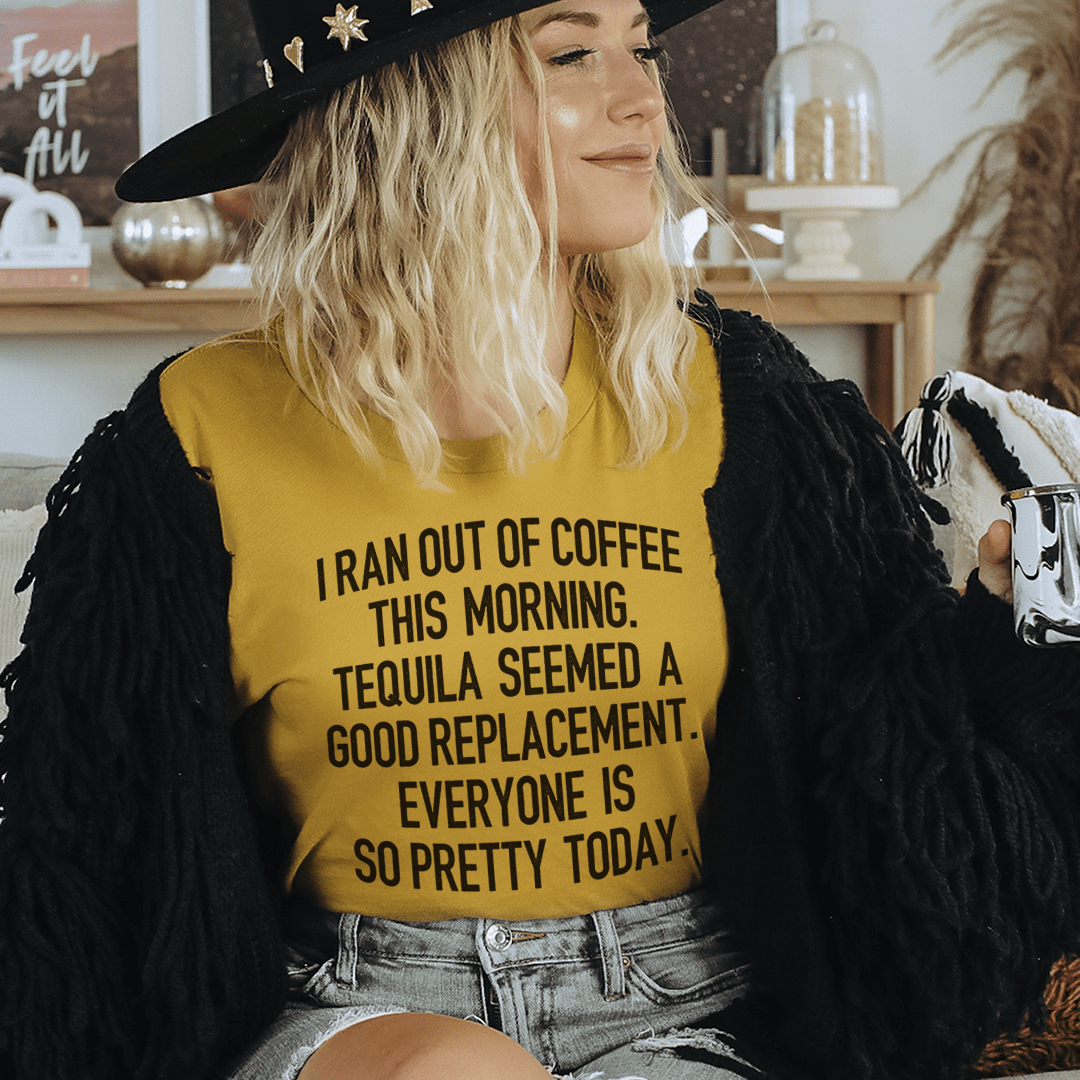 Mustard T-shirt on model with centered quote graphic, crew neck, short sleeves.