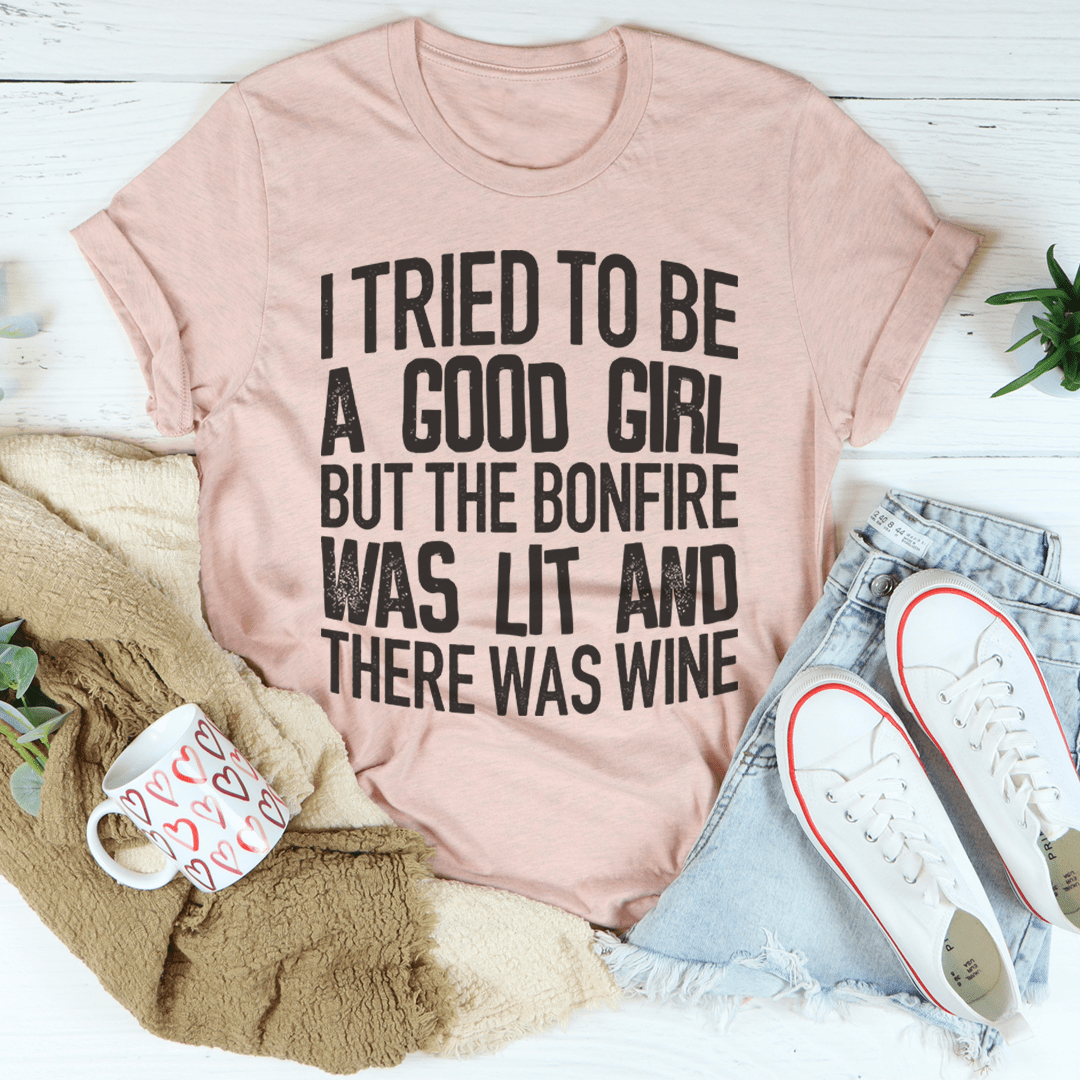 Heather peach graphic T-shirt with black slogan text on the front