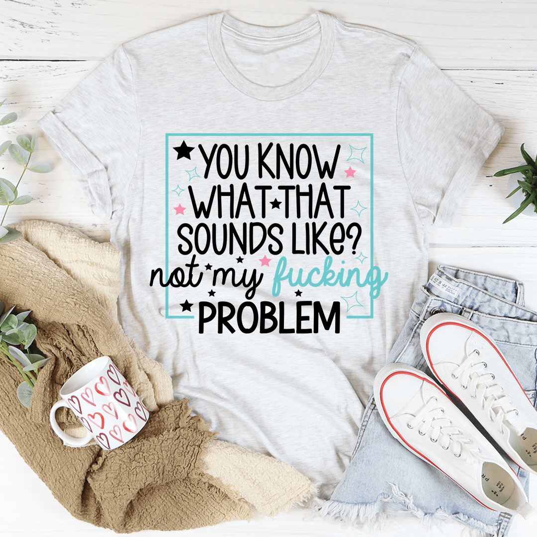 Light heather gray graphic slogan t-shirt with multicolor text and star border.