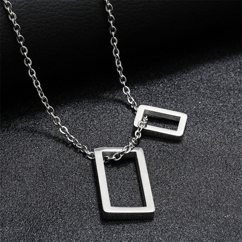 Silver geometric double-rectangle pendant necklace with two hanging outline bars