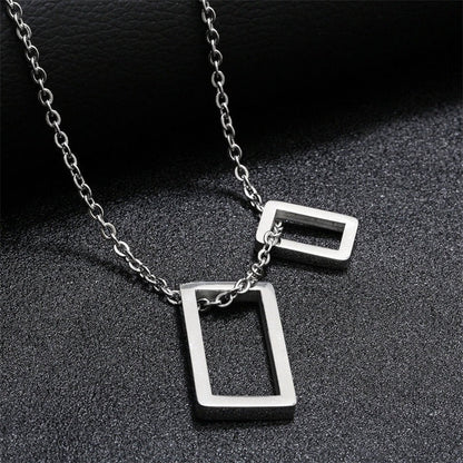 Silver geometric double-rectangle pendant necklace with two hanging outline bars