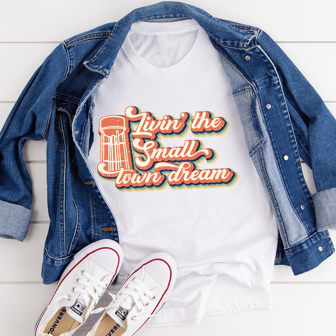White T-shirt with colorful lighthouse-style "Livin' the Small Town dream" print