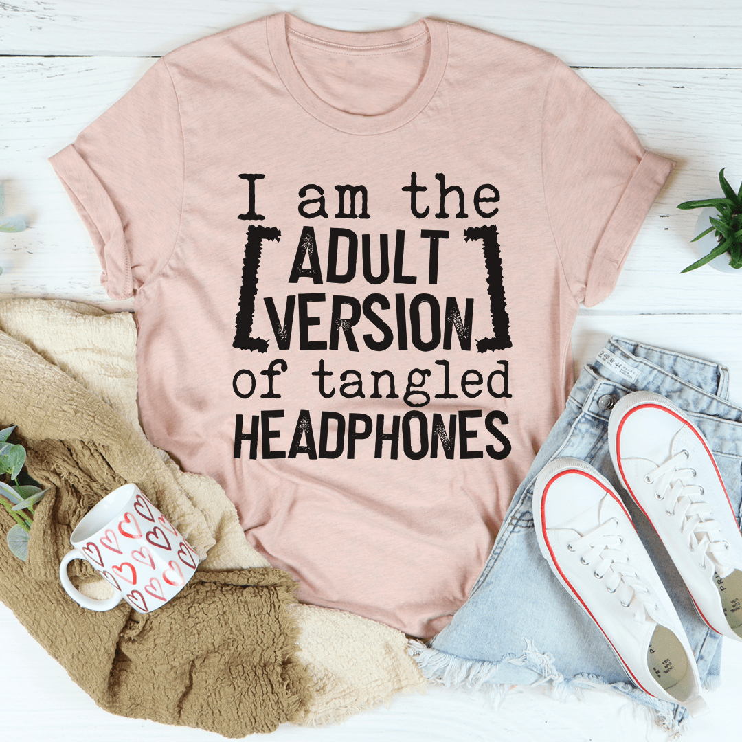 Light mauve crewneck T-shirt with black typography: ADULT VERSION of tangled HEADPHONES