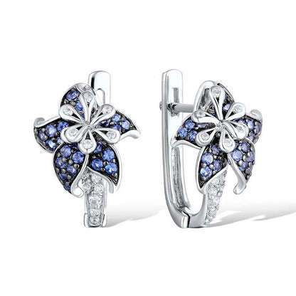 Silver-tone hoop-style earrings with blue flower clusters and clear zircon centers