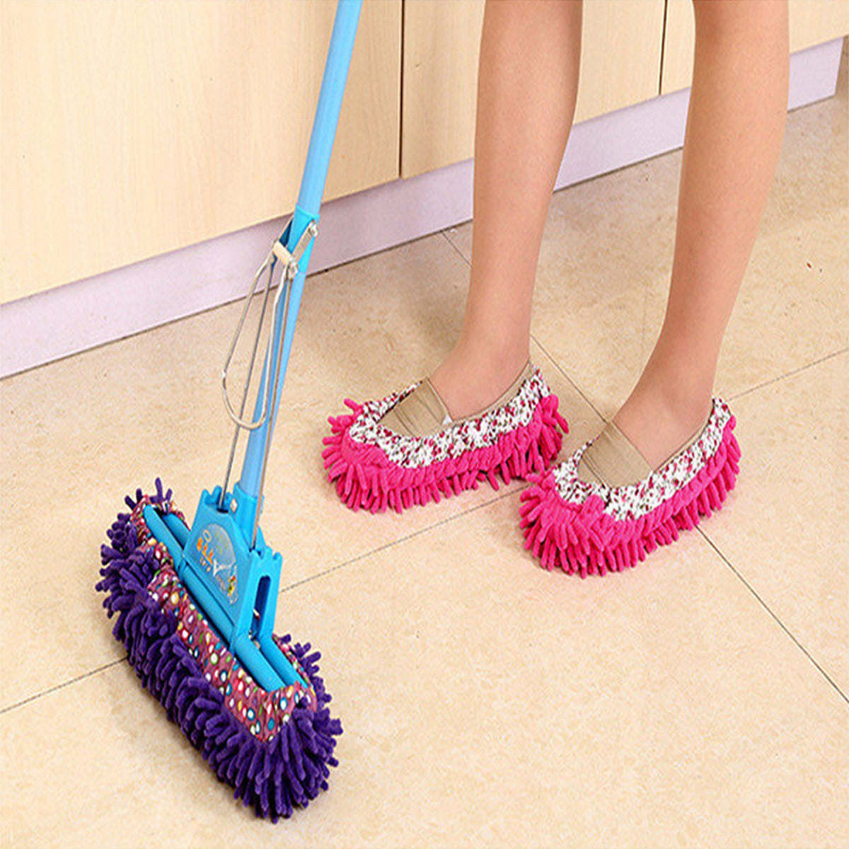 Pink slip-on mop slippers with patterned fabric trim and fringed microfiber.