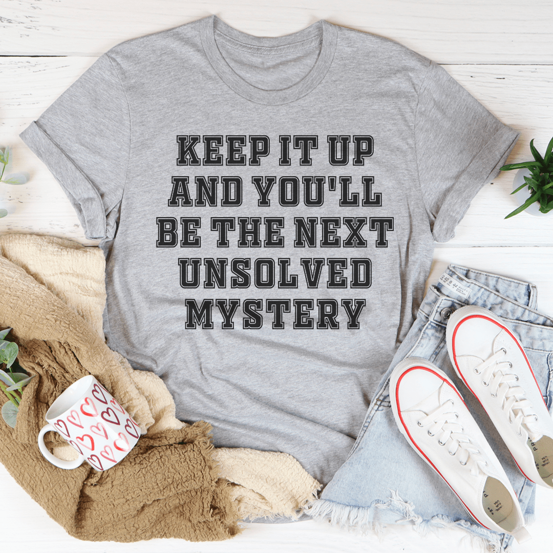 Graphic T-shirt with Unsolved Mystery text, heather gray