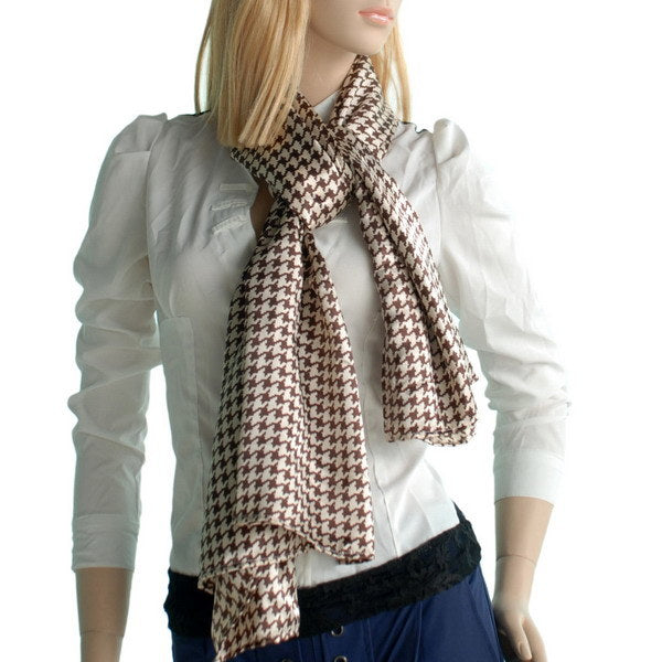 Silk scarf/wrap on model, brown-and-cream houndstooth pattern with long tied ends