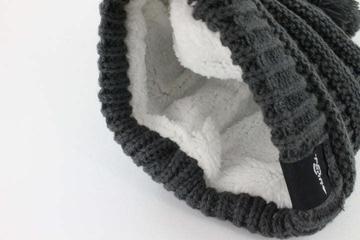 Women’s knit beanie with folded brim and plush inner lining, dark charcoal knit texture