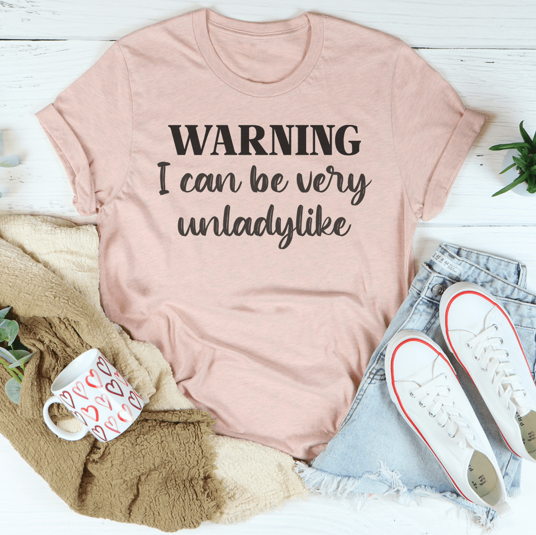 Mauve T-shirt with 'WARNING I can be very unladylike' print