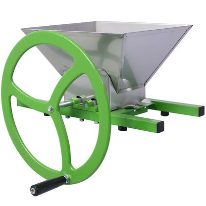 Manual juicer grinder front view with green wheel, stainless hopper, and feed chute