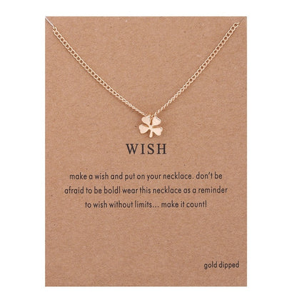 Gold-toned necklace chain with small four-leaf clover pendant