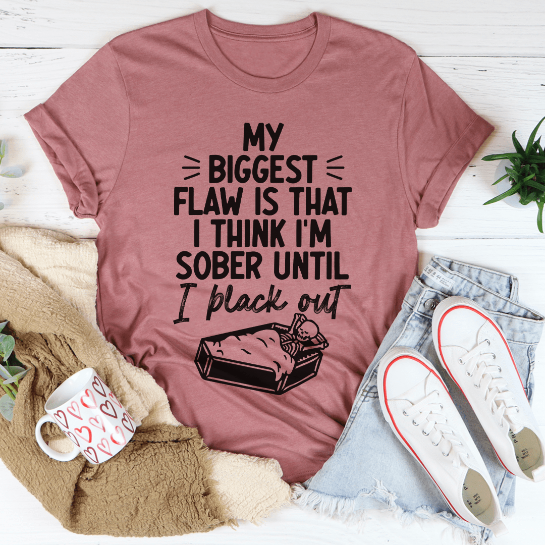 Mauve crew-neck T-shirt with bold black “My Biggest Flaw…” text and bottle artwork.