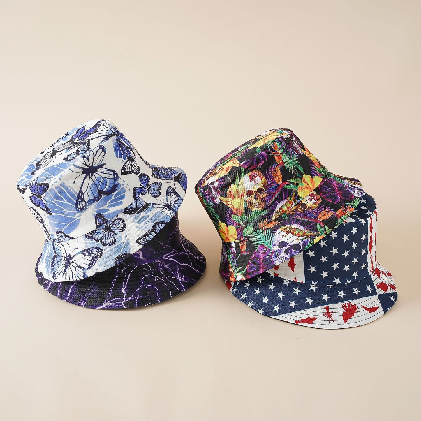 Two bucket hats: blue butterfly print and colorful graphic stars