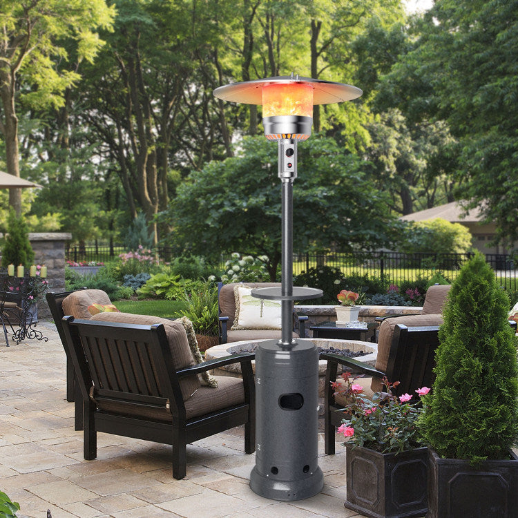 Propane patio heater with glowing burner, round reflector top, and black tank base