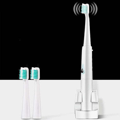 Ultrasonic toothbrush handle with two spare brush heads, white and mint-blue bristles
