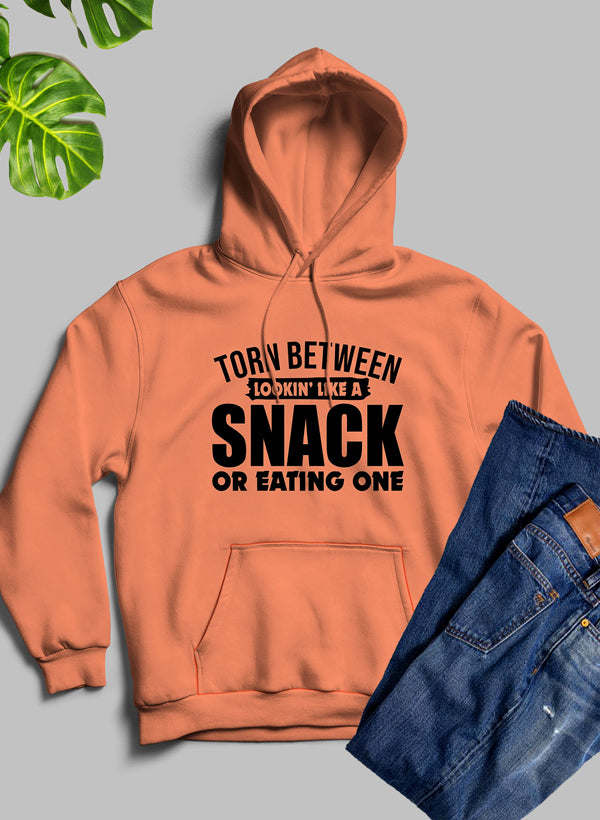 Peach/orange hoodie with front kangaroo pocket and bold 'SNACK' graphic, hood up