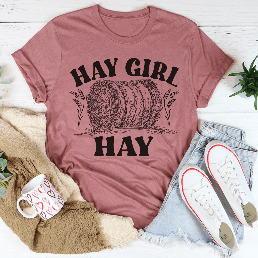 Women’s graphic T-shirt in mauve pink with “Hay Girl” top text and “Hay” bottom text