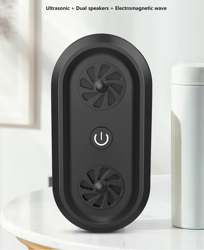 Black ultrasonic pest repellent unit front view with dual speaker grilles and power icon