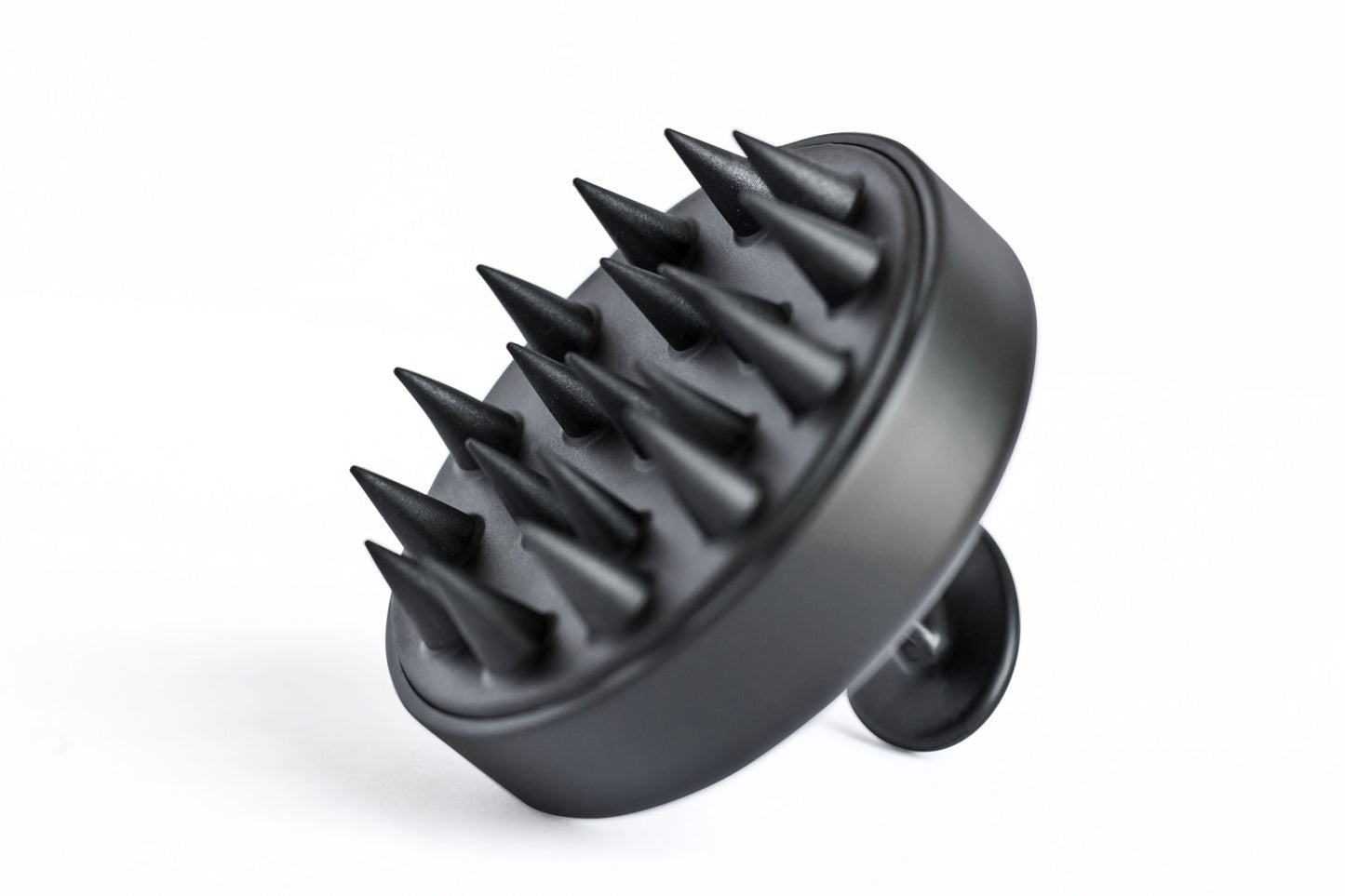 Black scalp massager with angled prongs and rounded base
