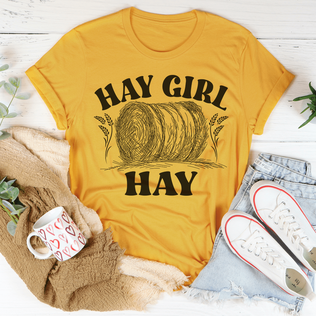 Women’s mustard yellow crewneck graphic t-shirt with 'HAY GIRL' and 'HAY' print