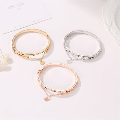Three stainless steel bangle bracelets with Roman numerals, stones, and heart pendants