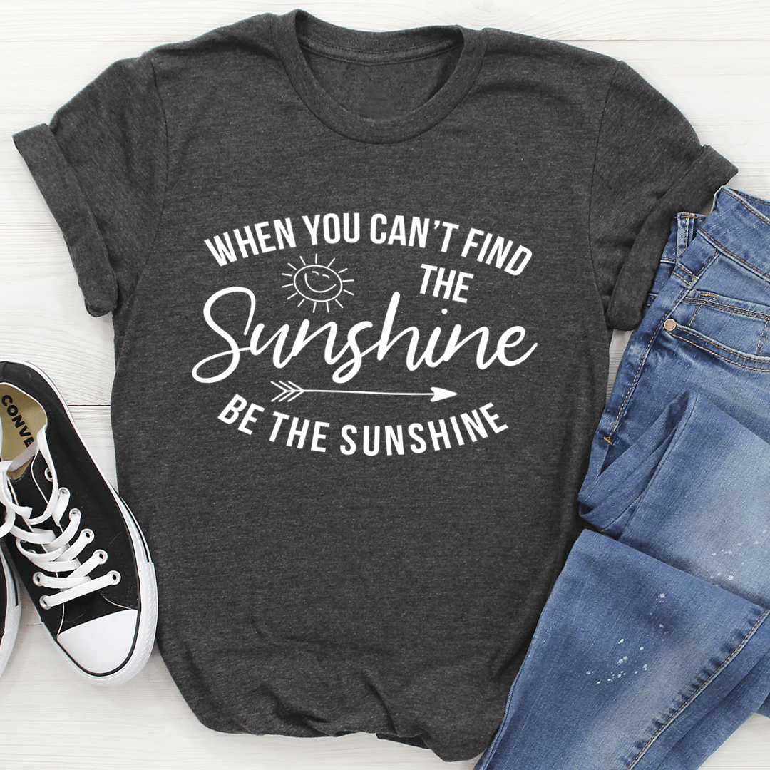 Dark grey crew-neck T-shirt with 'Sunshine' print and 'Be the Sunshine' slogan.