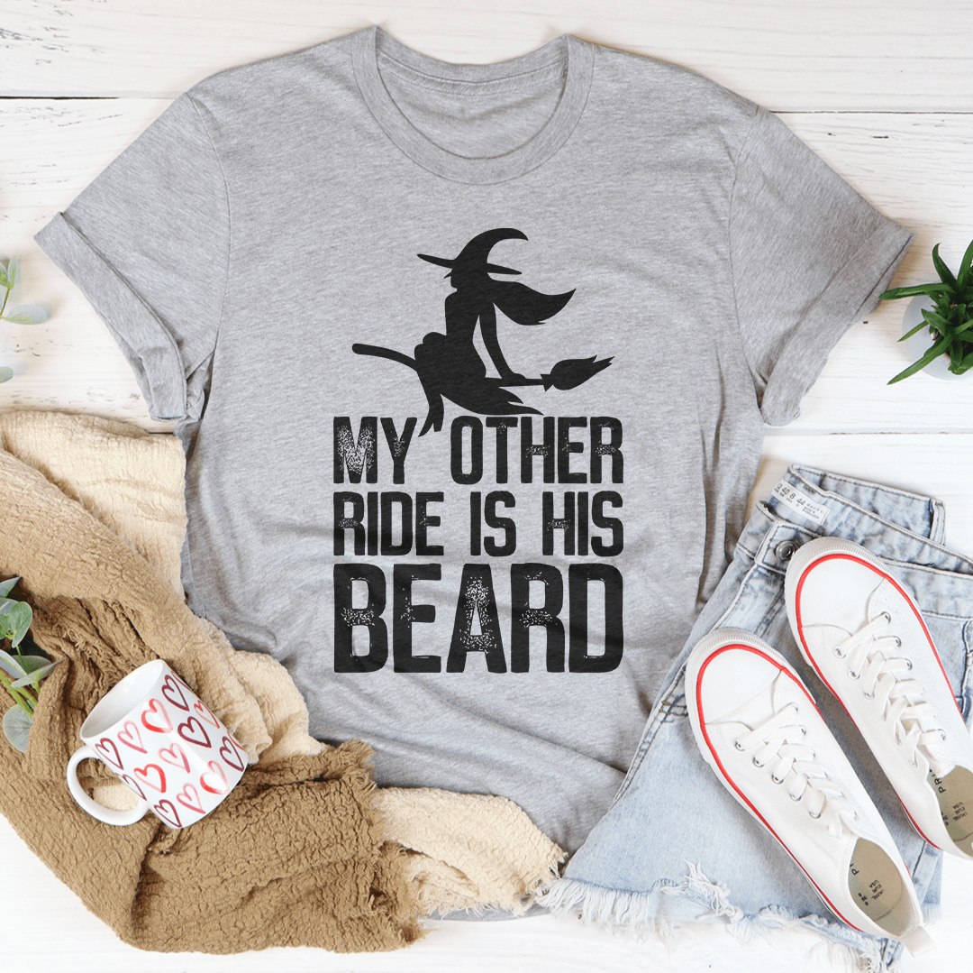 Gray T-shirt with black cowboy silhouette graphic and stacked text: My Other Ride Is His Beard
