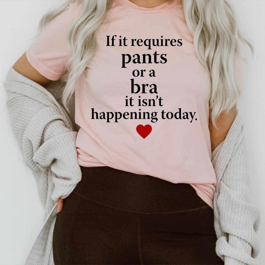 Pink crewneck T-shirt with black quote text and small red heart print