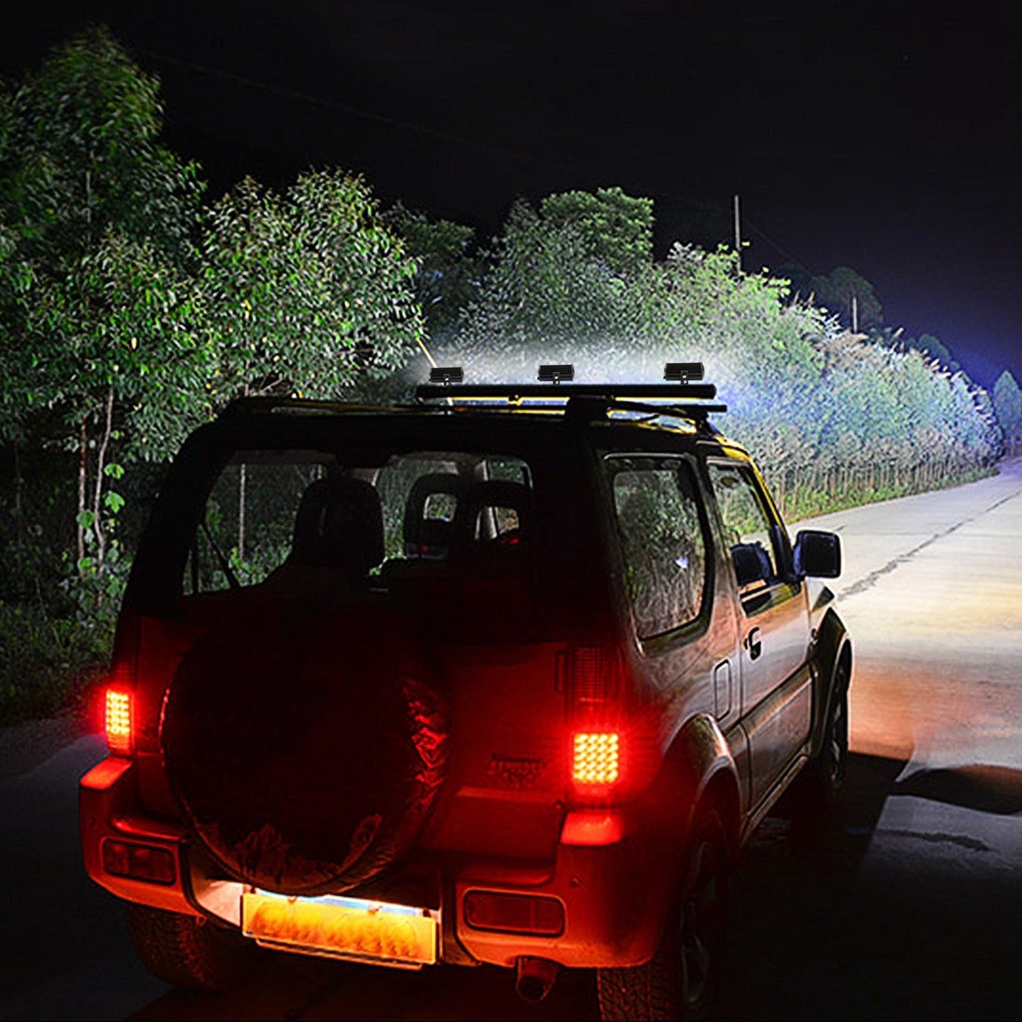 Illuminated LED light bar mounted on a vehicle roof, casting a bright beam