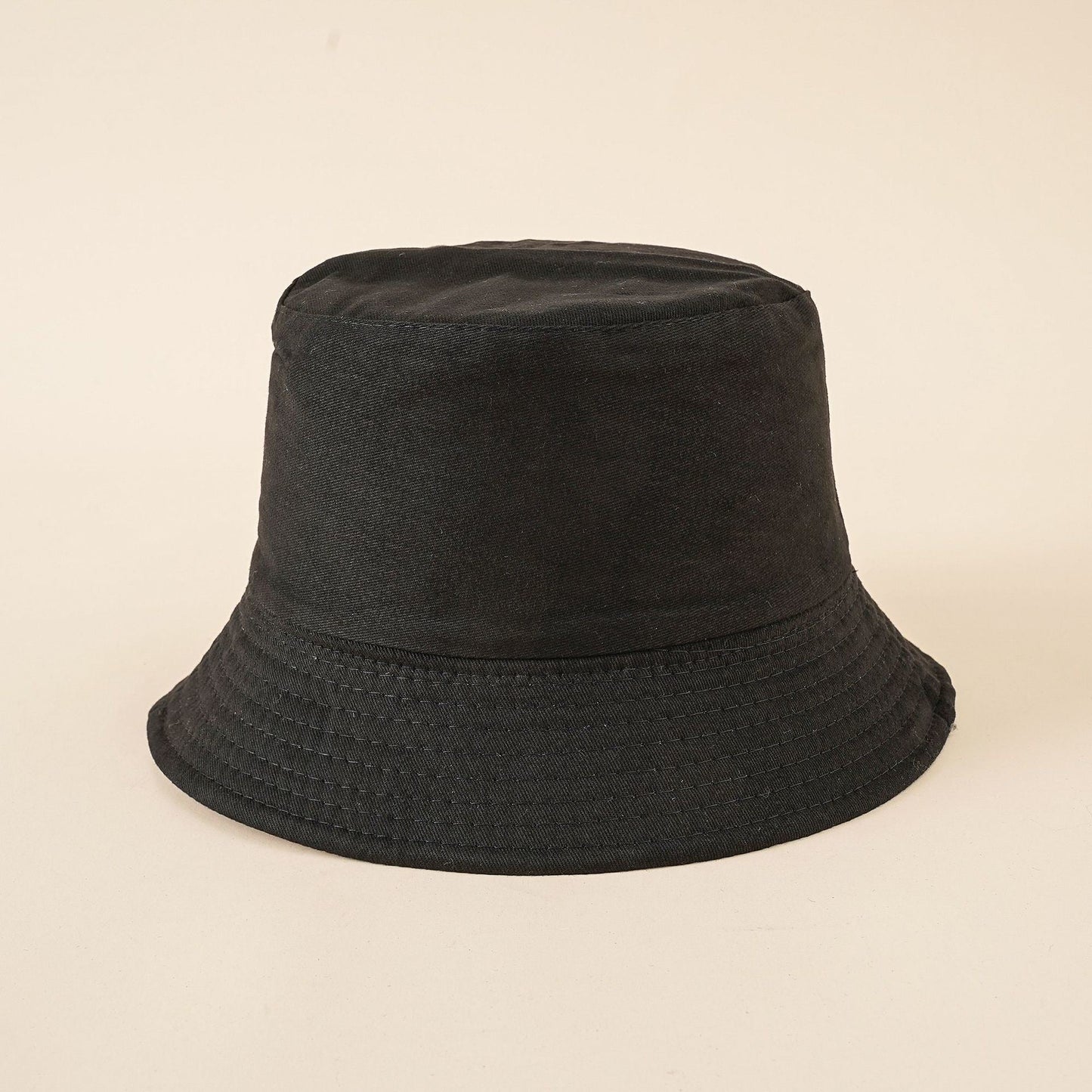Women's black bucket hat with eyelet-stitch brim and round crown