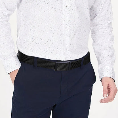 Nylon ratchet belt with textured dark webbing, worn with navy trousers