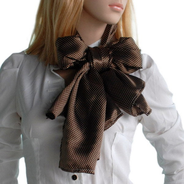 Brown polka-dot silk scarf around model’s neck