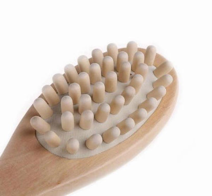 Rounded massage brush with dense bristle nodes on a wooden body