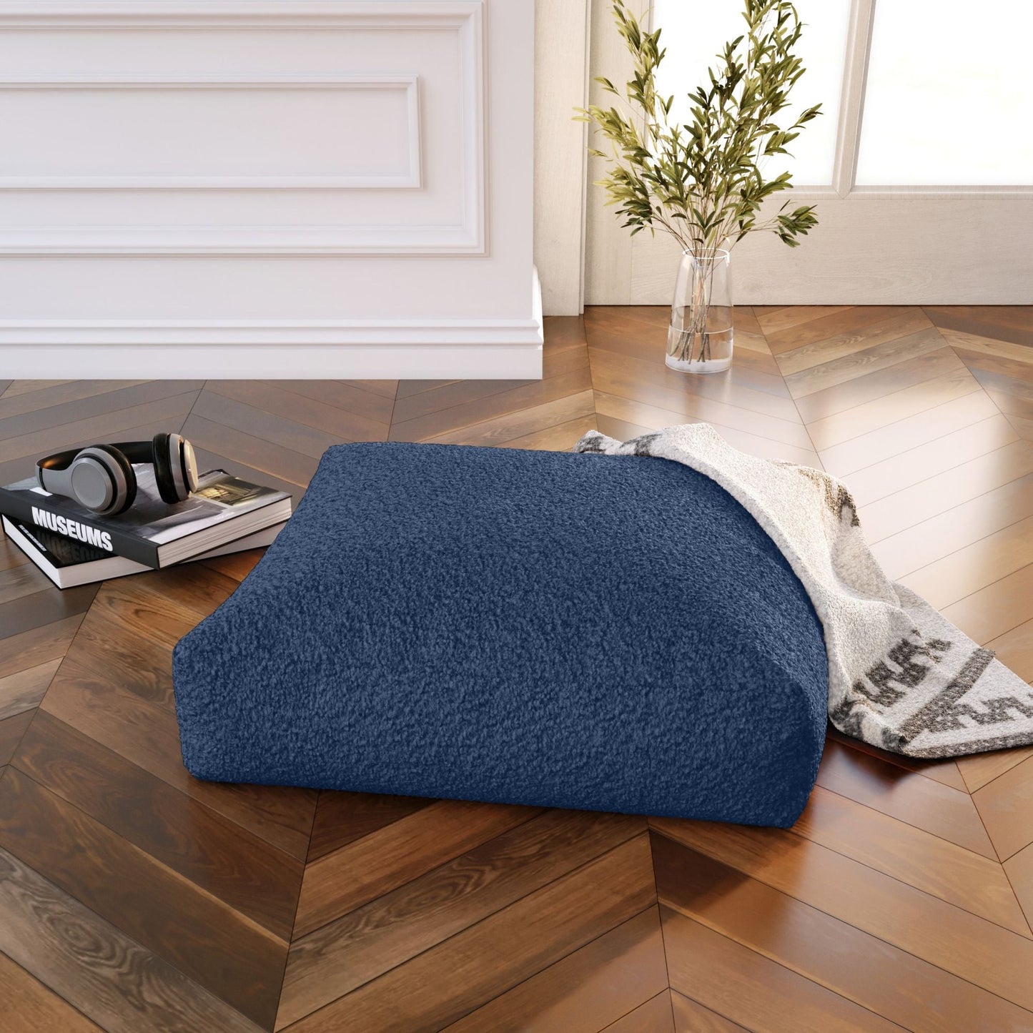 Indigo and beige faux shearling floor pillow with rounded end and stitched seam