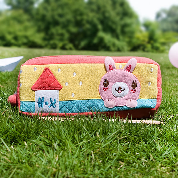 Embroidered pencil pouch with rabbit applique, yellow and teal panels, pink trim, zipper