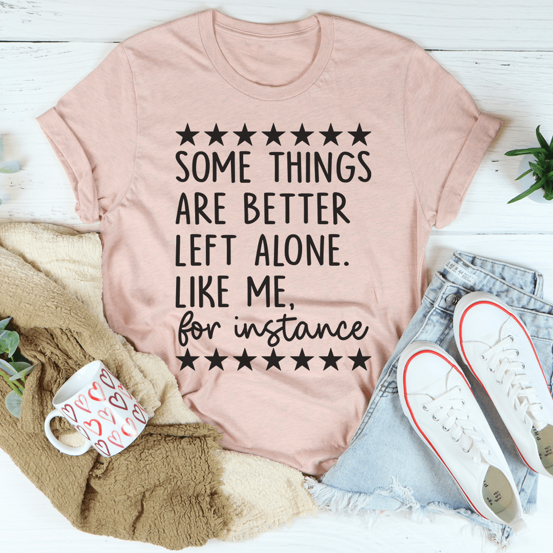 Mauve graphic T-shirt with black stars and 'Some things are better left alone' text