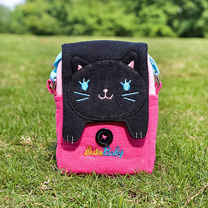 Cat swingpack bag with pink body, black flap, and embroidered eyes and Little Baby text.