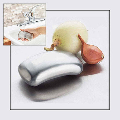 Odor remover bar with onion and garlic pieces beside it, plus small sink inset