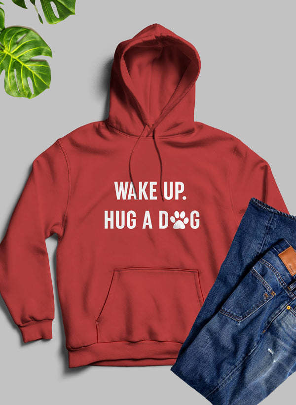 Red hoodie with hood and front pocket, "WAKE UP. HUG A DOG" white print