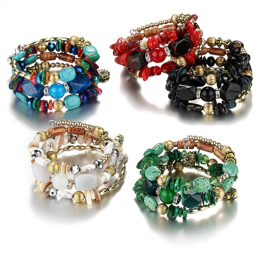 Set of four multilayer boho charm bracelets with red, black, turquoise, and green beads