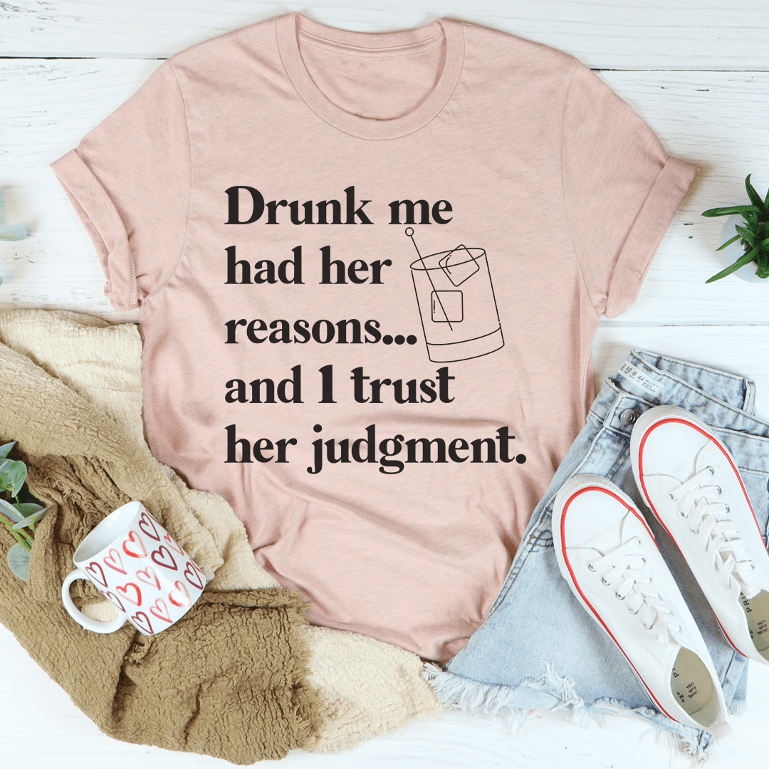Light pink crew-neck T-shirt with drink-themed quote graphic on front
