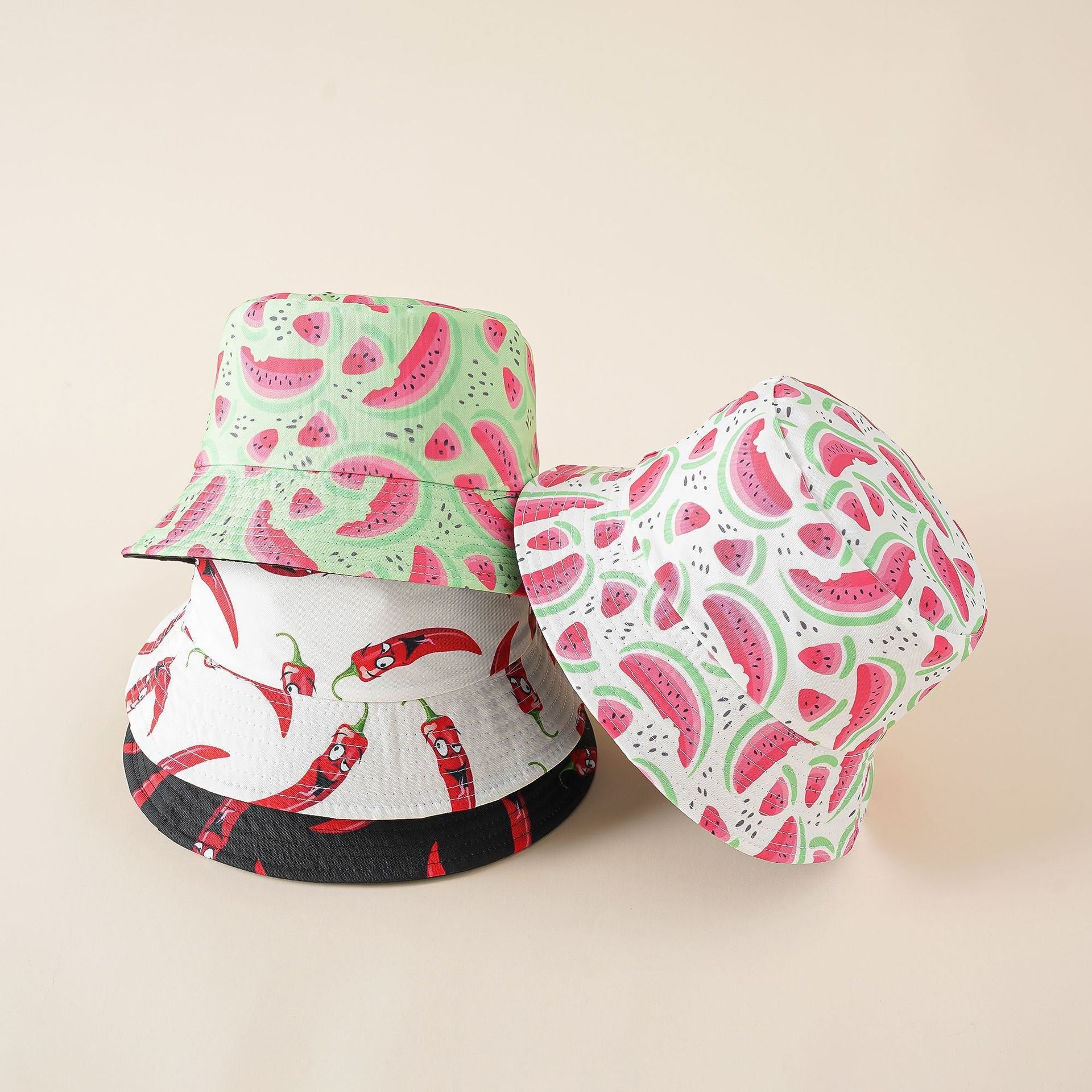 Reversible bucket hat: watermelon print side and chili pepper print side