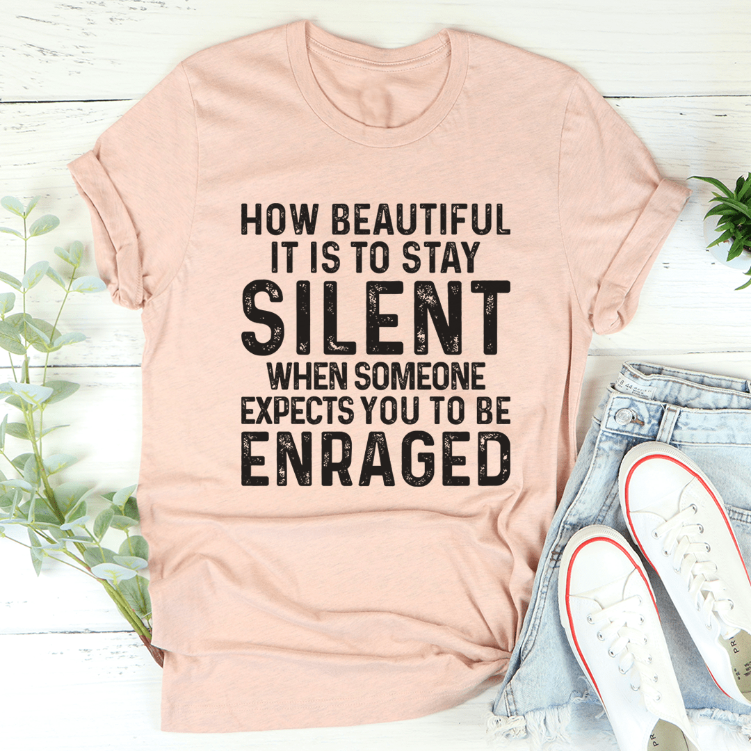 Peach T-shirt with bold 'STAY SILENT' quote graphic