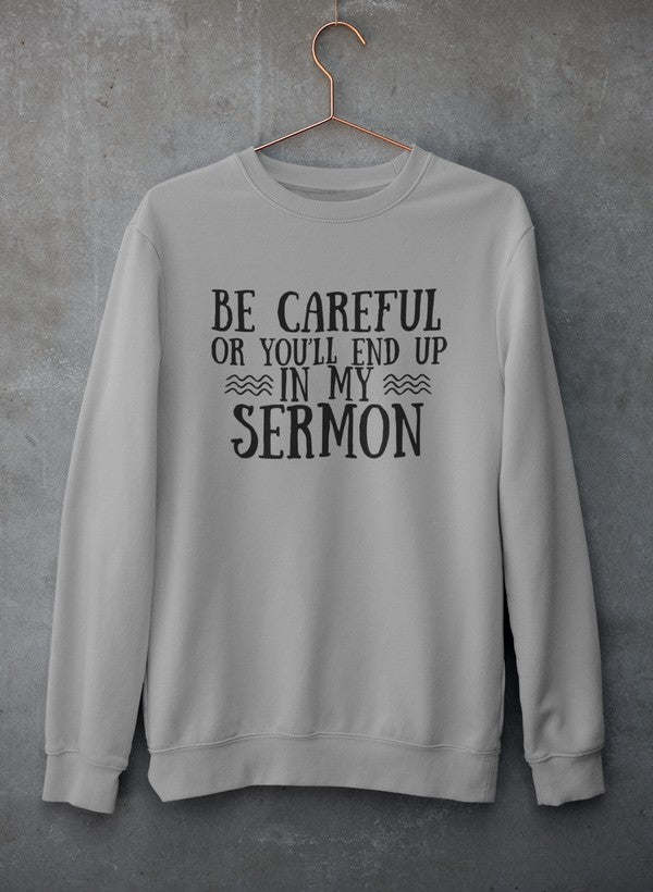 Light gray hoodie with hood and front pocket, featuring 'Be Careful...Sermon'