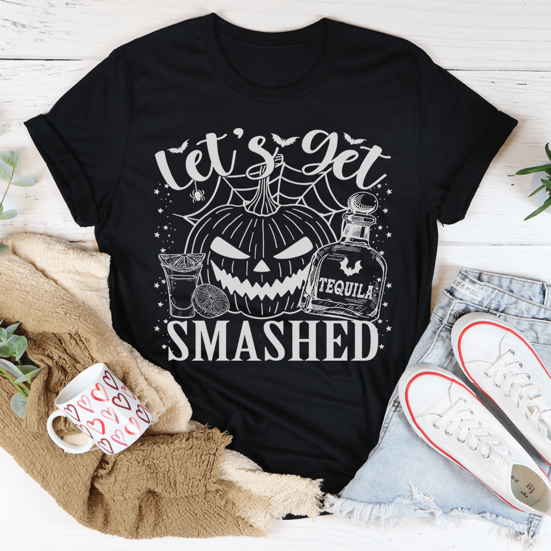 Black pumpkin graphic T-shirt with 'SMASHED' text and cocktail illustration.