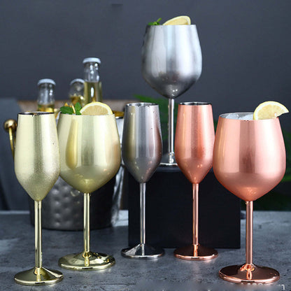 Set of metallic cocktail glasses in silvery, gold, copper, and rose colors