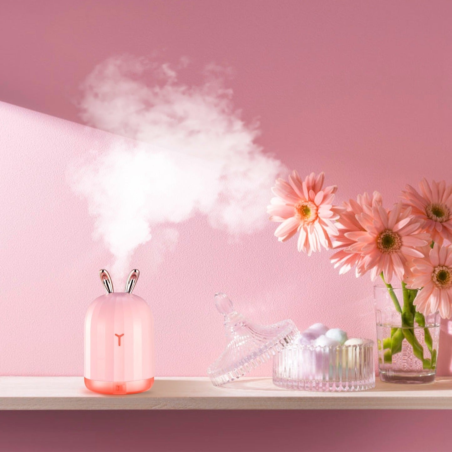 Pink bunny cool mist humidifier releasing mist with soft pink ambient light