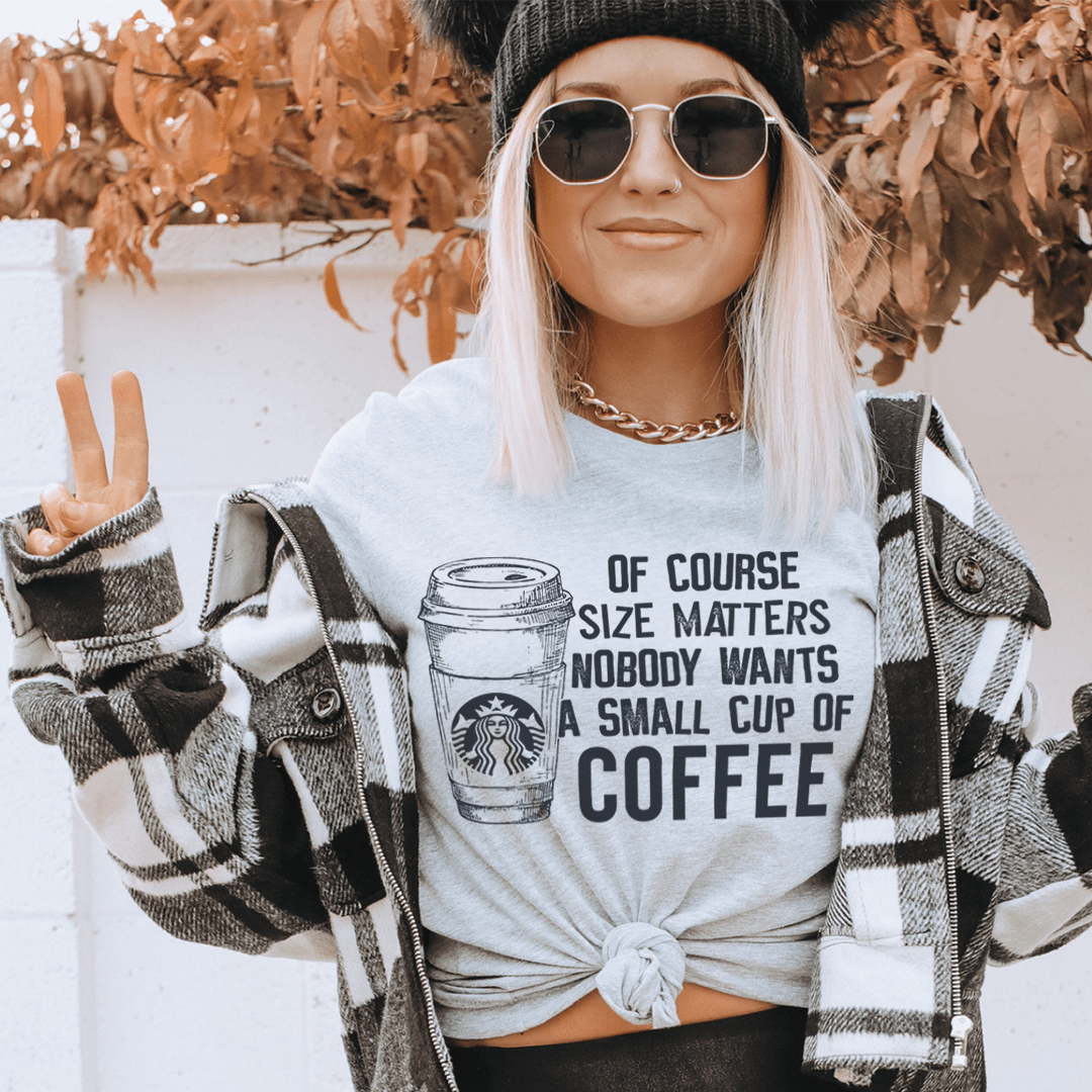 Light gray T-shirt with coffee cup quote graphic, crew neck, front twist detail.